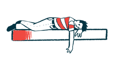 A person in a red and white striped shirt lies face down on a surface, appearing depressed