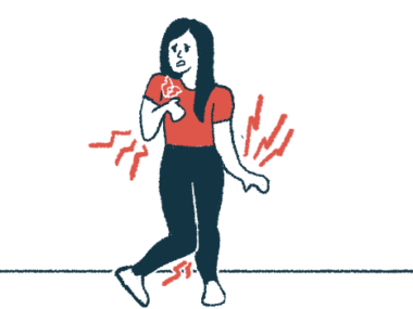 A woman looking pained deals with uncontrolled movements in her arms, hands, and feet.